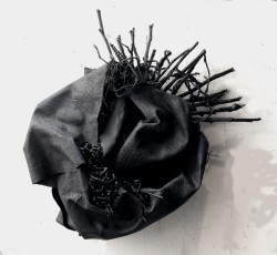 "Masked" by Gilda PervinBurlap, Acrylic paint, twine & twigsDimension: 12' x13' x 5.5"Price on Request